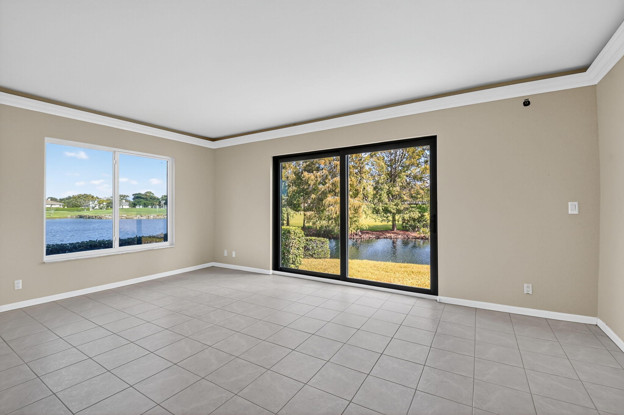 900 Greensward Lane, Unit 101G Delray Beach, FL 33445 - Photo 9 of 62 a view of an empty room with a window