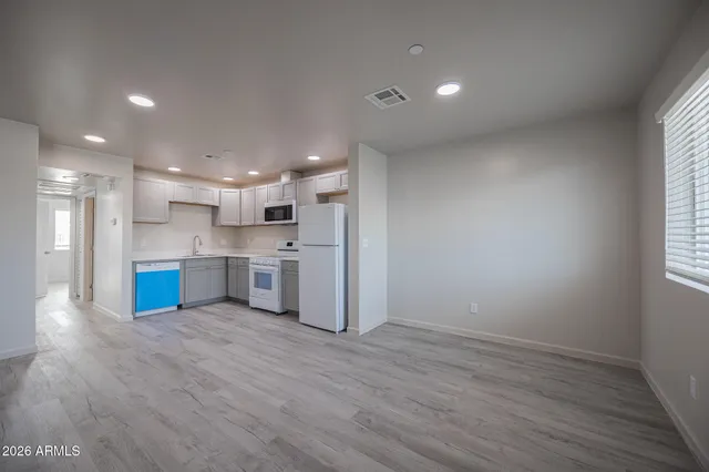 a view of kitchen with wooden floor