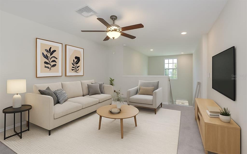 797 Olive Conch Street Ruskin, FL 33570 - Photo 14 of 53 a living room with furniture and a flat screen tv