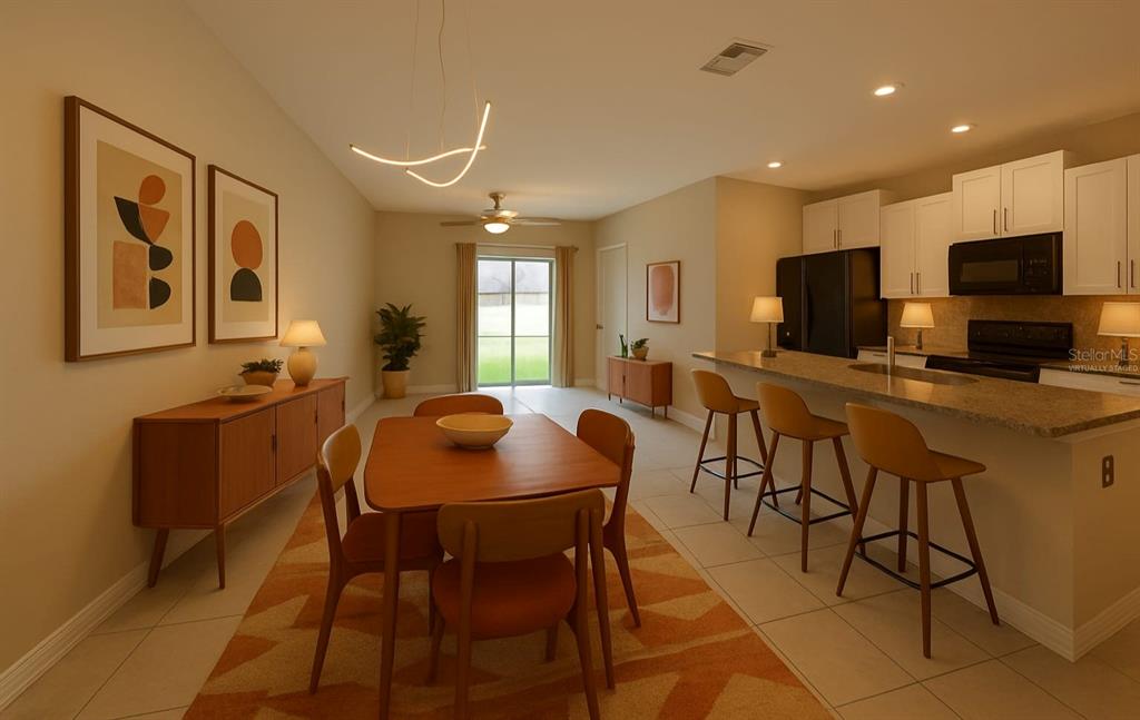 797 Olive Conch Street Ruskin, FL 33570 - Photo 16 of 53 a view of a dining room with furniture