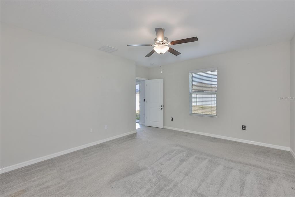 797 Olive Conch Street Ruskin, FL 33570 - Photo 19 of 53 a view of an empty room with a window