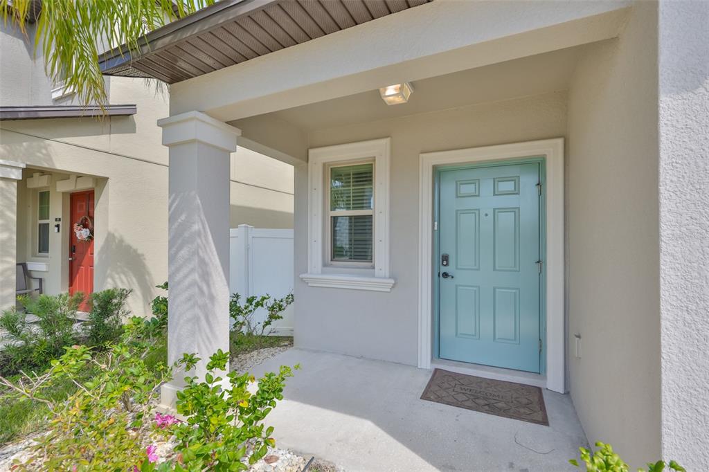 797 Olive Conch Street Ruskin, FL 33570 - Photo 2 of 53 a front view of a house with an outdoor space
