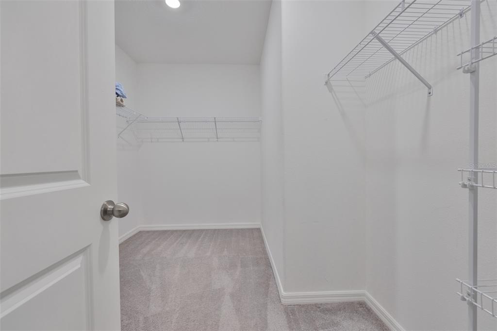 797 Olive Conch Street Ruskin, FL 33570 - Photo 21 of 53 a view of a room with racks on the wall