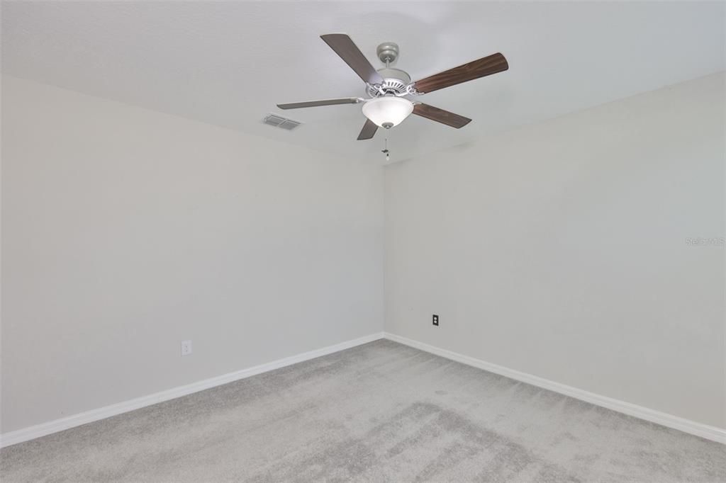 797 Olive Conch Street Ruskin, FL 33570 - Photo 33 of 53 an empty room with a window