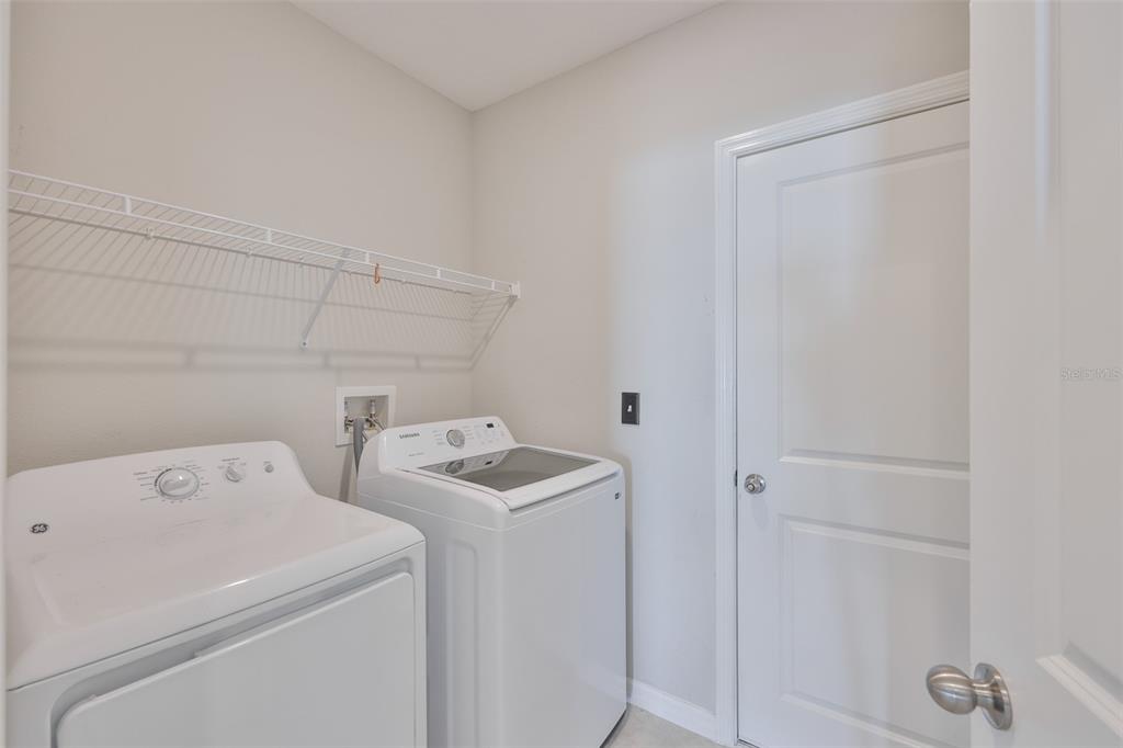 797 Olive Conch Street Ruskin, FL 33570 - Photo 34 of 53 a utility room with dryer and washer