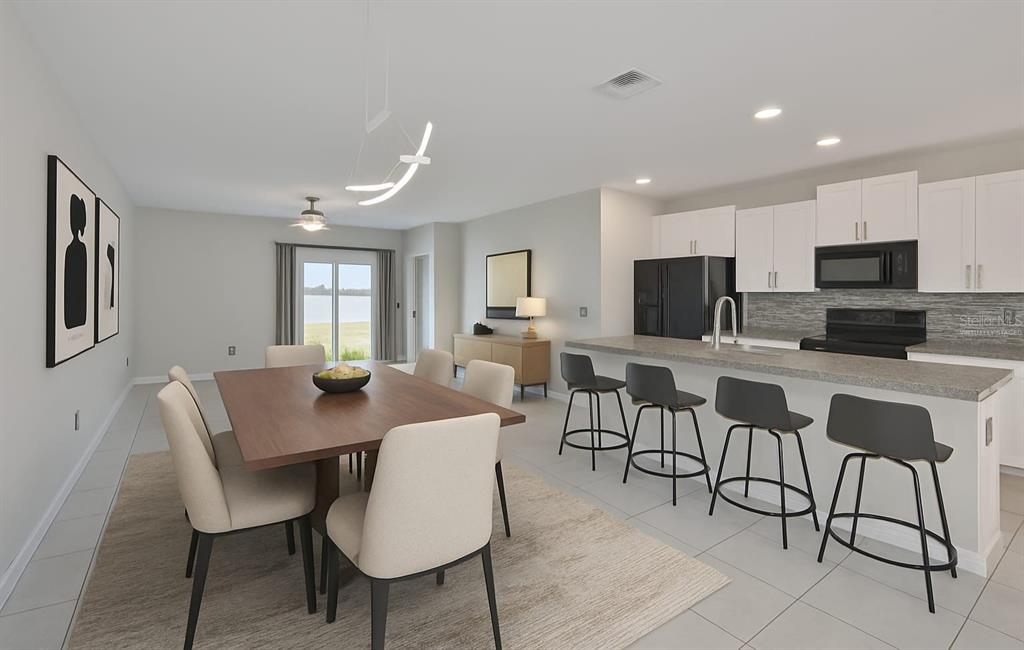 797 Olive Conch Street Ruskin, FL 33570 - Photo 4 of 53 a view of a dining room with furniture