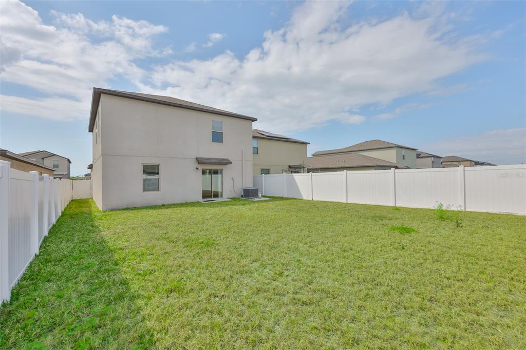 797 Olive Conch Street Ruskin, FL 33570 - Photo 41 of 53 a view of a backyard
