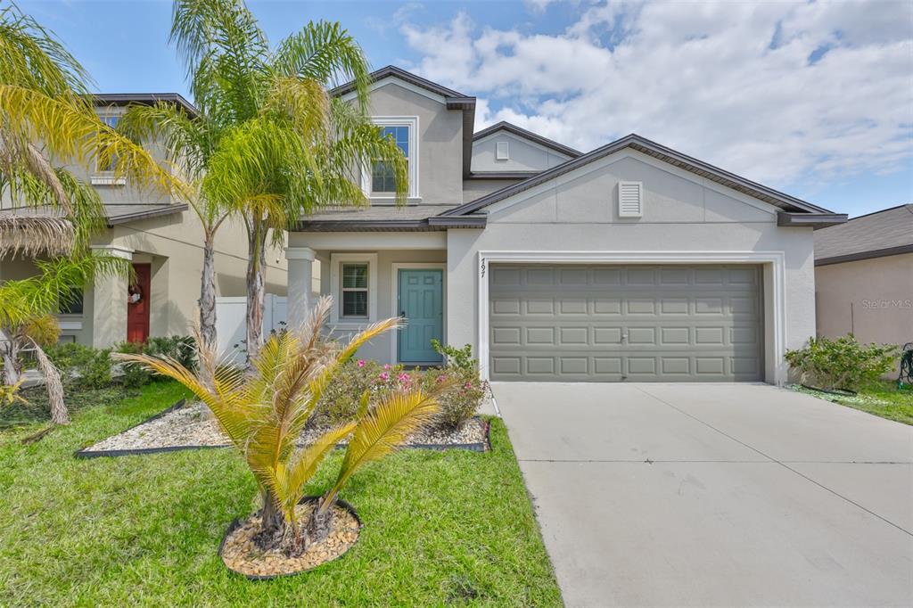 797 Olive Conch Street Ruskin, FL 33570 - Photo 43 of 53 a front view of a house with garden