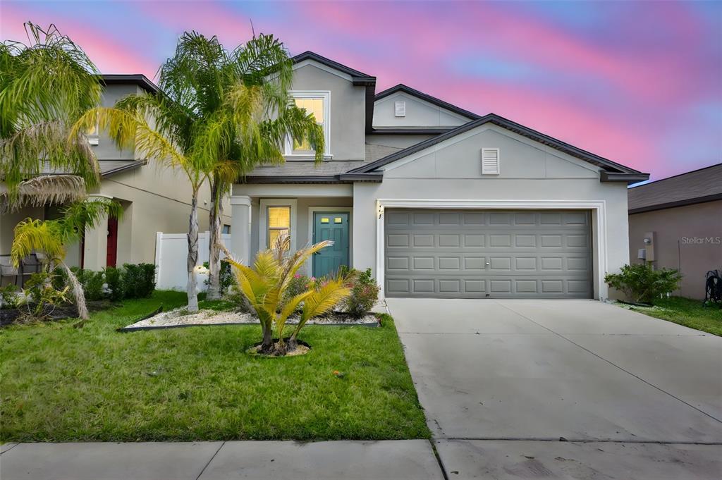 797 Olive Conch Street Ruskin, FL 33570 - Photo 44 of 53 a front view of house with yard and green space