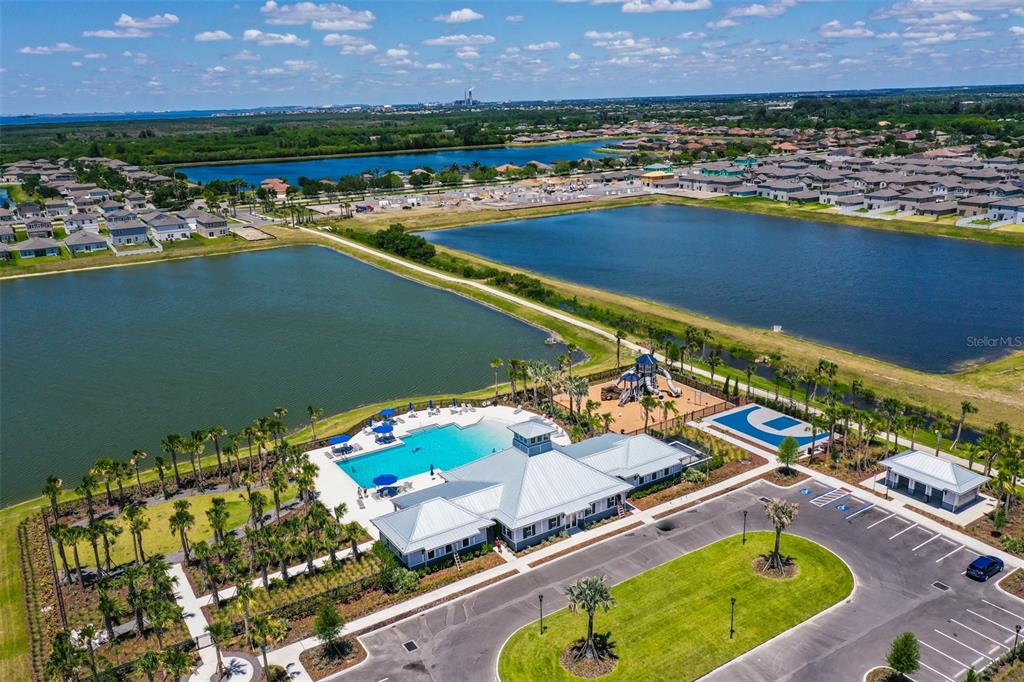 797 Olive Conch Street Ruskin, FL 33570 - Photo 53 of 53 an aerial view of a resort with a swimming pool and outdoor seating