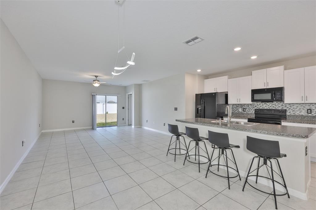 797 Olive Conch Street Ruskin, FL 33570 - Photo 7 of 53 a view of kitchen and window
