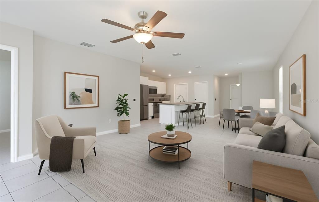 797 Olive Conch Street Ruskin, FL 33570 - Photo 10 of 53 a living room with furniture and a view of kitchen