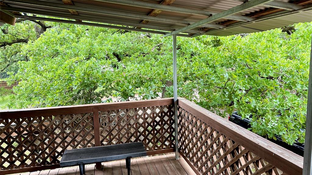 126 Garza Road Shady Shores, TX 76208 - Photo 15 of 19 a view of a green yard from a balcony