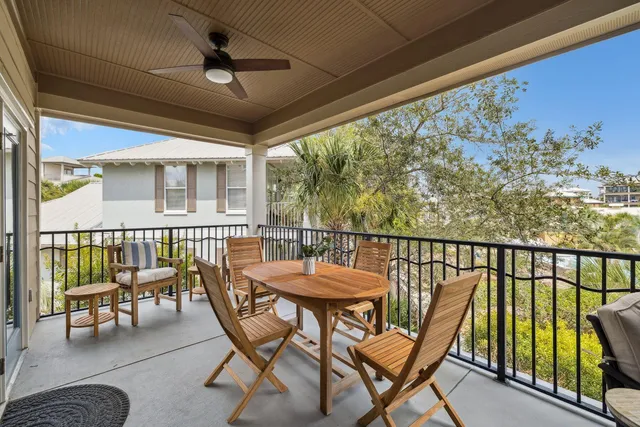 a view of a chairs and table in patio