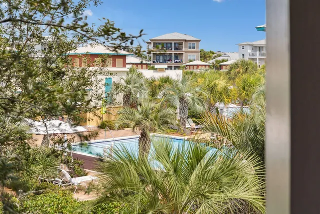 a view of swimming pool from a lake view