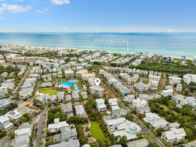 an aerial view of residential building and ocean