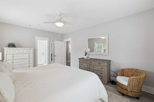 a bedroom with a bed a couch and dresser