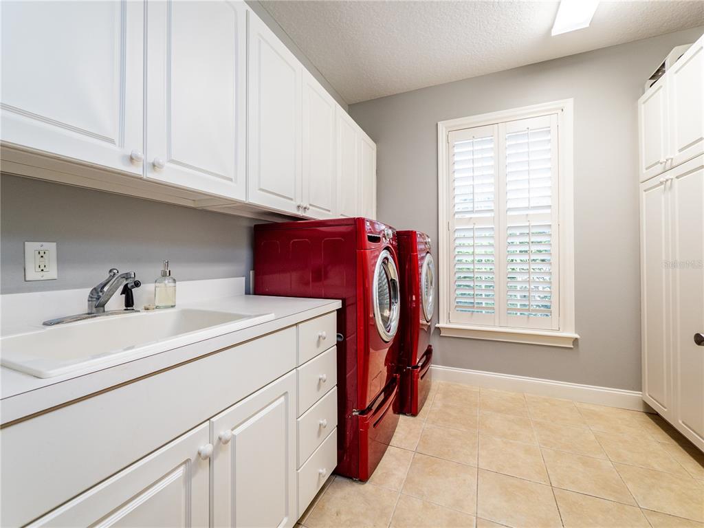 1945 Southwest 40th Place Ocala, FL 34471 - Photo 12 of 31 a utility room with dryer and washer
