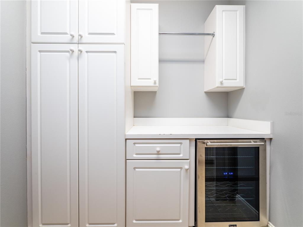 1945 Southwest 40th Place Ocala, FL 34471 - Photo 13 of 31 a view of a kitchen with white cabinets and a sink