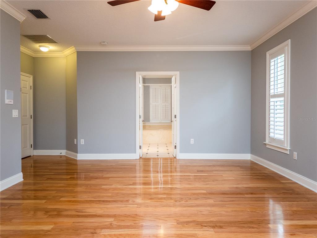 1945 Southwest 40th Place Ocala, FL 34471 - Photo 15 of 31 a view of an empty room with window and wooden floor