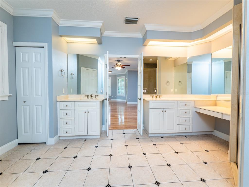 1945 Southwest 40th Place Ocala, FL 34471 - Photo 17 of 31 a large bathroom with a sink mirror and a shower