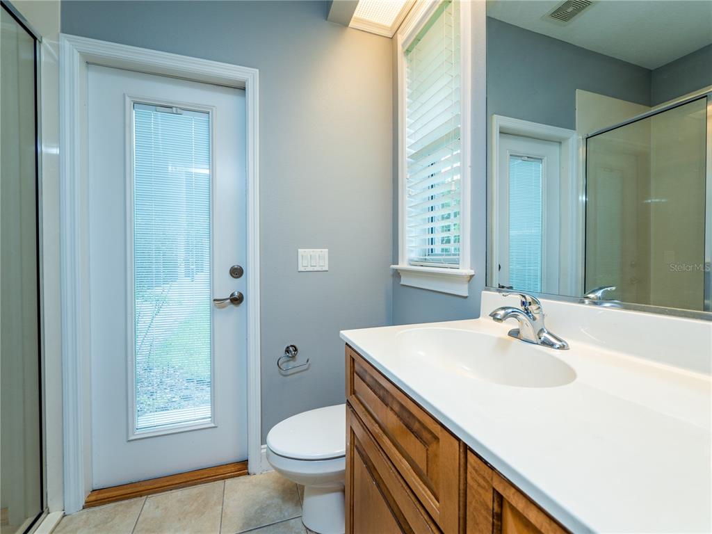 1945 Southwest 40th Place Ocala, FL 34471 - Photo 20 of 31 a bathroom with a sink toilet and shower