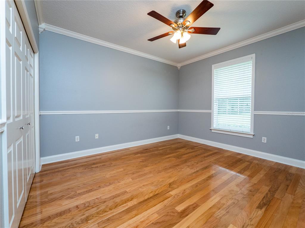 1945 Southwest 40th Place Ocala, FL 34471 - Photo 22 of 31 a view of an empty room with window and chandelier fan