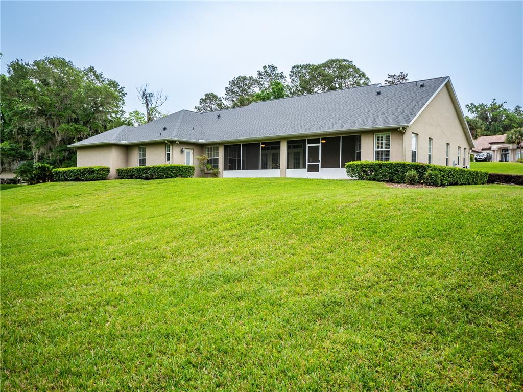 1945 Southwest 40th Place Ocala, FL 34471 - Photo 26 of 31 a front view of a house with a garden