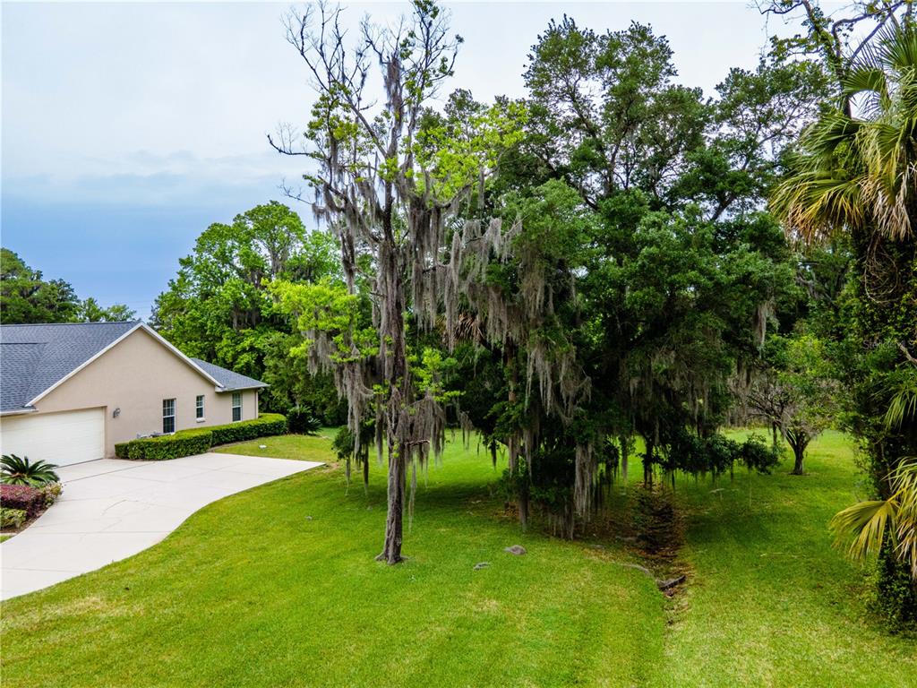 1945 Southwest 40th Place Ocala, FL 34471 - Photo 27 of 31 a view of an house with a yard