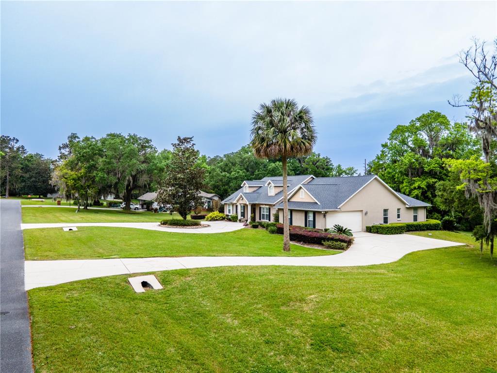 1945 Southwest 40th Place Ocala, FL 34471 - Photo 28 of 31 a aerial view of a house with swimming pool garden and lake view
