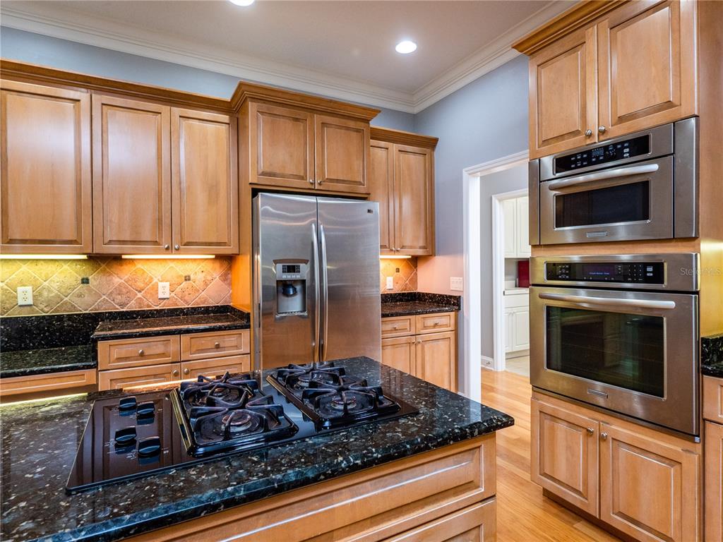 1945 Southwest 40th Place Ocala, FL 34471 - Photo 10 of 31 a kitchen with stainless steel appliances granite countertop a stove and a refrigerator