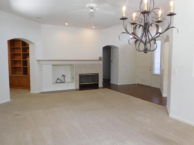 a view of an empty room with a fireplace