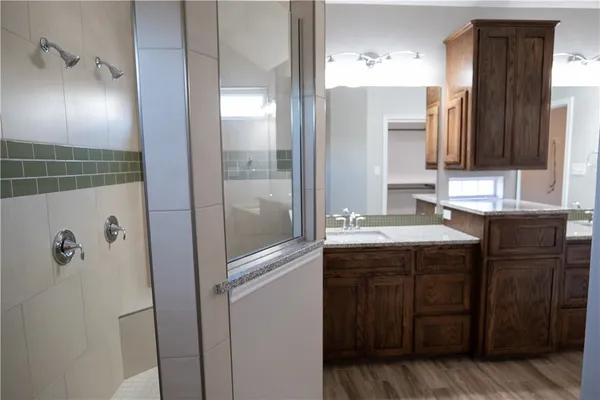 a bathroom with a sink and a mirror