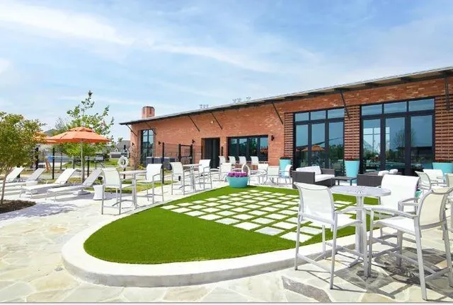 a view of a swimming pool with outdoor seating