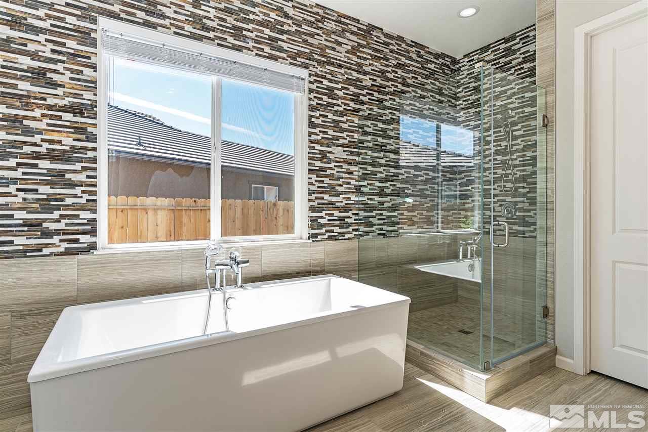 9818 Dyevera Lane Reno, NV 89521 - Photo 19 of 25 a bathroom with a bathtub and shower