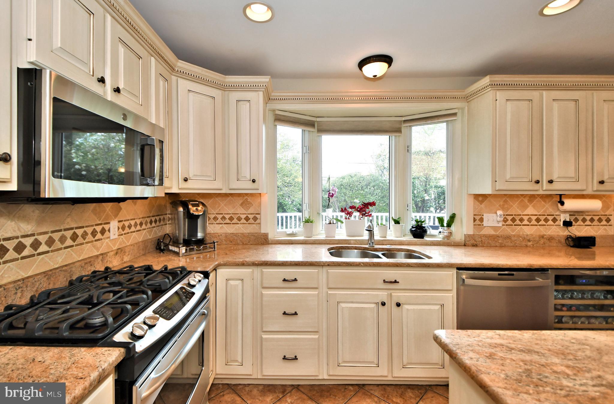 405 Crest Road Oreland, PA 19075 - Photo 13 of 43 Kitchen with built-in microwave and gas stove