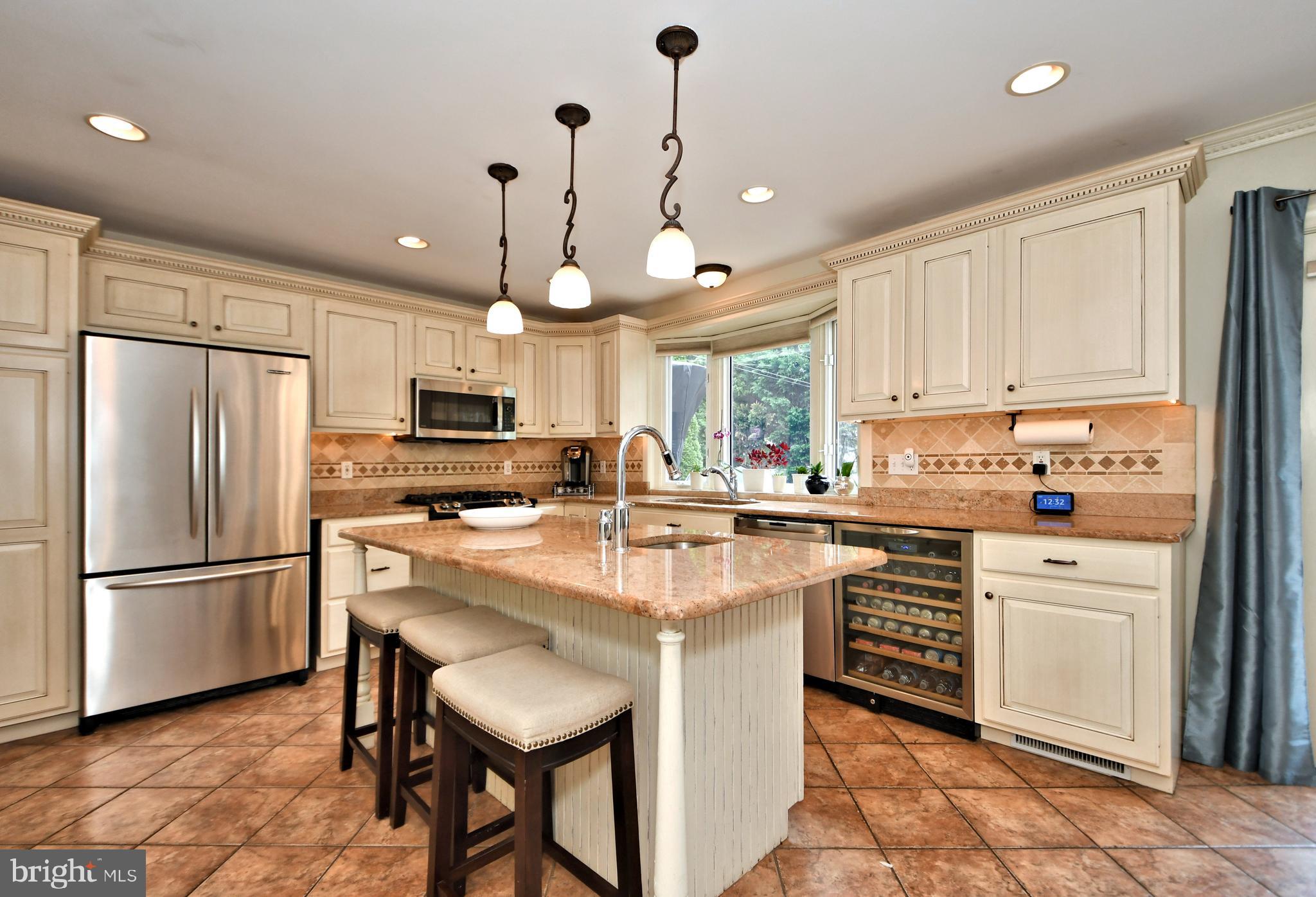 405 Crest Road Oreland, PA 19075 - Photo 15 of 43 Kitchen with island and wine fridge