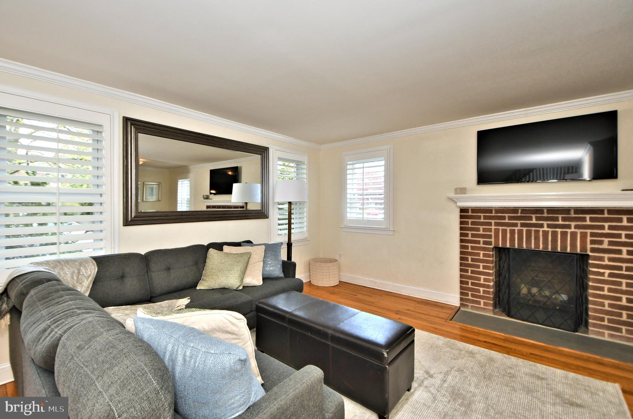 405 Crest Road Oreland, PA 19075 - Photo 5 of 43 Living room with custom shutters