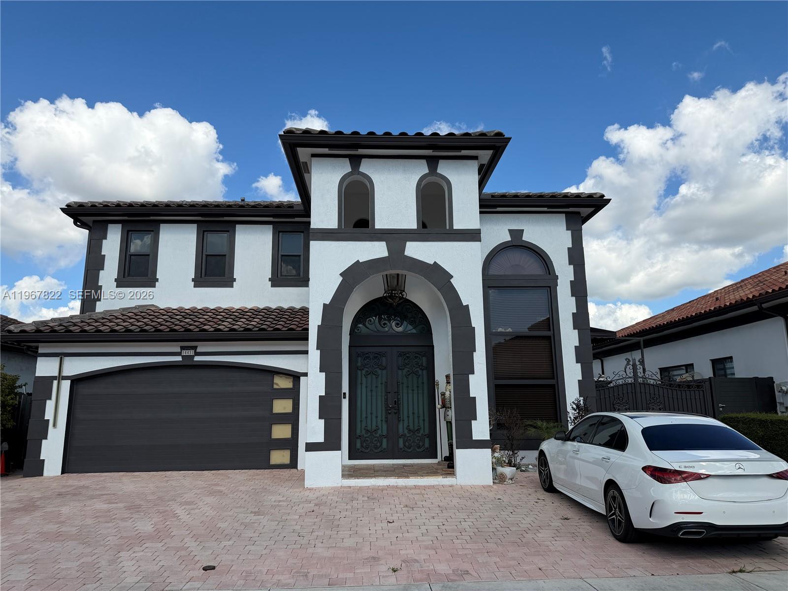 14431 Southwest 22nd Terrace Miami, FL 33175 - Photo 1 of 12 a view of a car parked in front of house