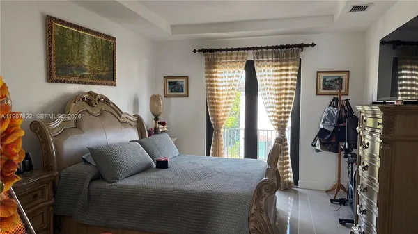 a bed room with a bed and a window