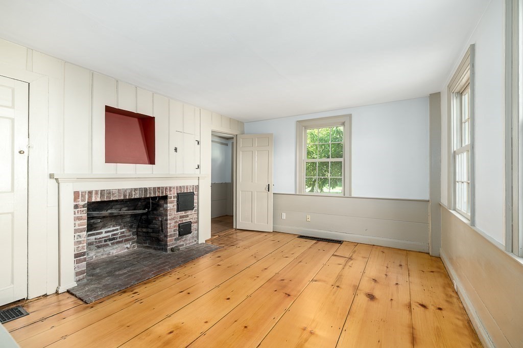 5 Middleton Road Boxford, MA 01921 - Photo 12 of 41 a view of empty room with wooden floor and fireplace