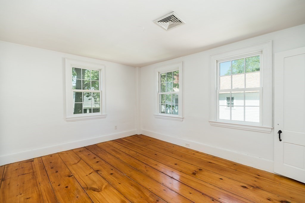 5 Middleton Road Boxford, MA 01921 - Photo 17 of 41 a view of an empty room with wooden floor and a window