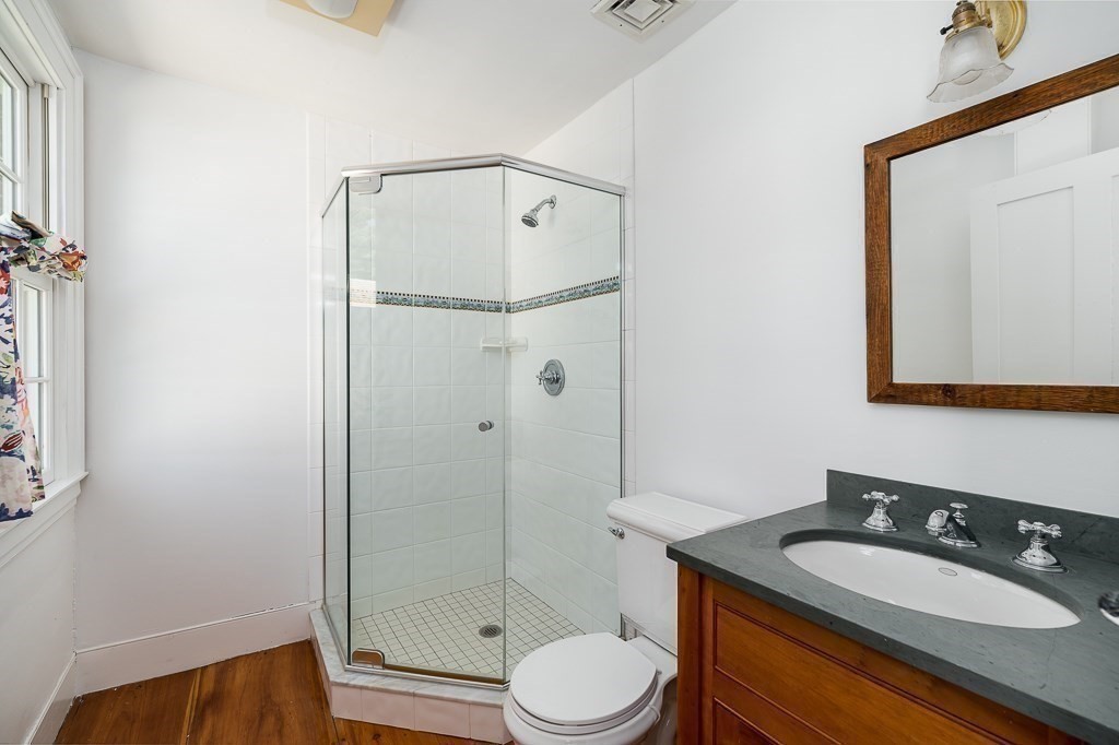 5 Middleton Road Boxford, MA 01921 - Photo 18 of 41 a bathroom with a granite countertop sink toilet a mirror and shower