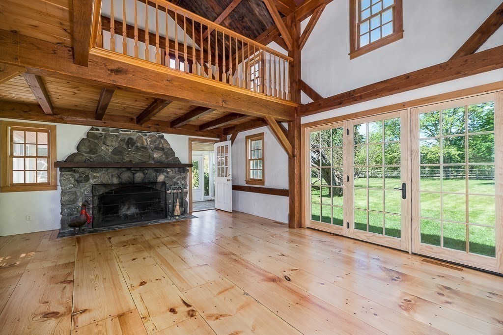 5 Middleton Road Boxford, MA 01921 - Photo 22 of 41 a view of an empty room with wooden floor fireplace and a window
