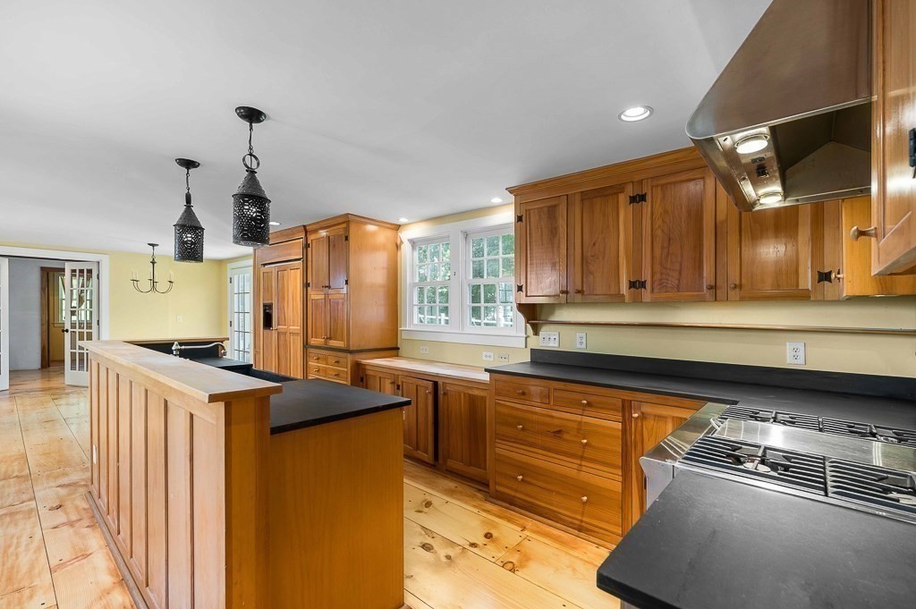 5 Middleton Road Boxford, MA 01921 - Photo 6 of 41 a kitchen with stainless steel appliances granite countertop a sink a stove and a refrigerator