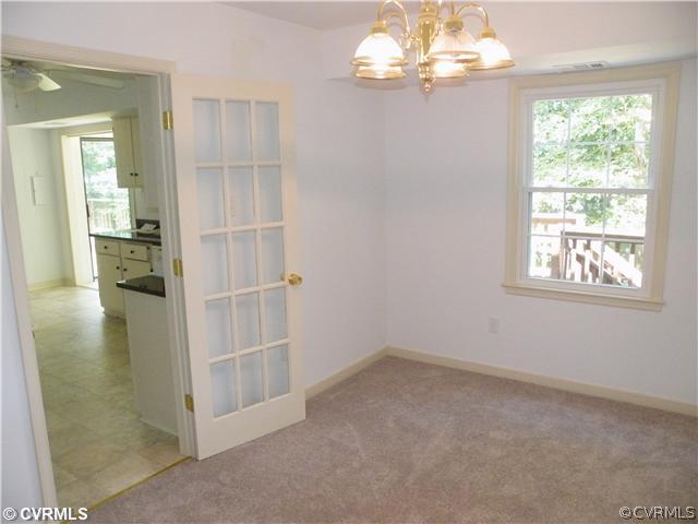4703 Wilconna Road Chesterfield, VA 23832 - Photo 5 of 12 en empty room with windows and entrance