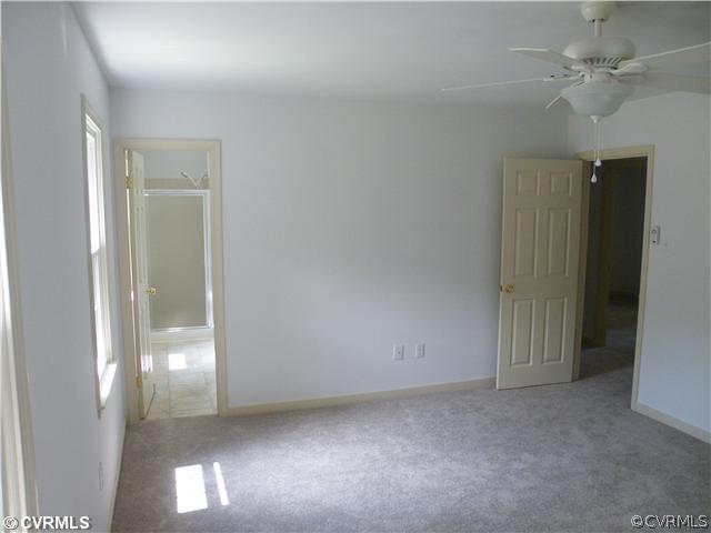 4703 Wilconna Road Chesterfield, VA 23832 - Photo 8 of 12 en empty room with windows and fan