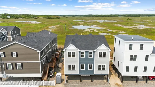 a aerial view of a house with a ocean view