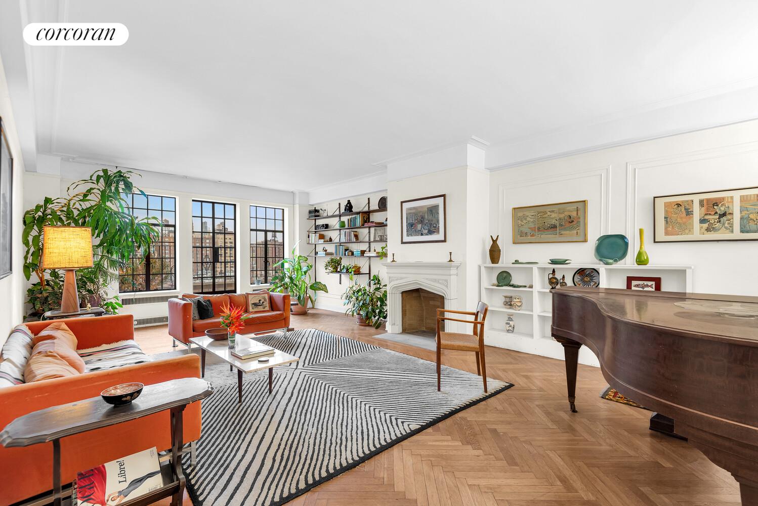 300 Central Park West, Unit 9A Manhattan, NY 10024 - Photo 4 of 15 a living room with furniture large window and a fireplace