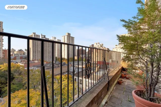 a view of a dining room with furniture and window
